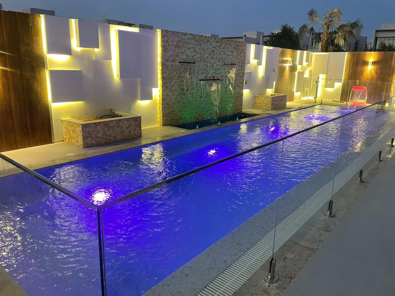 Illuminated outdoor kitchen with built-in BBQ and tap, Dubai