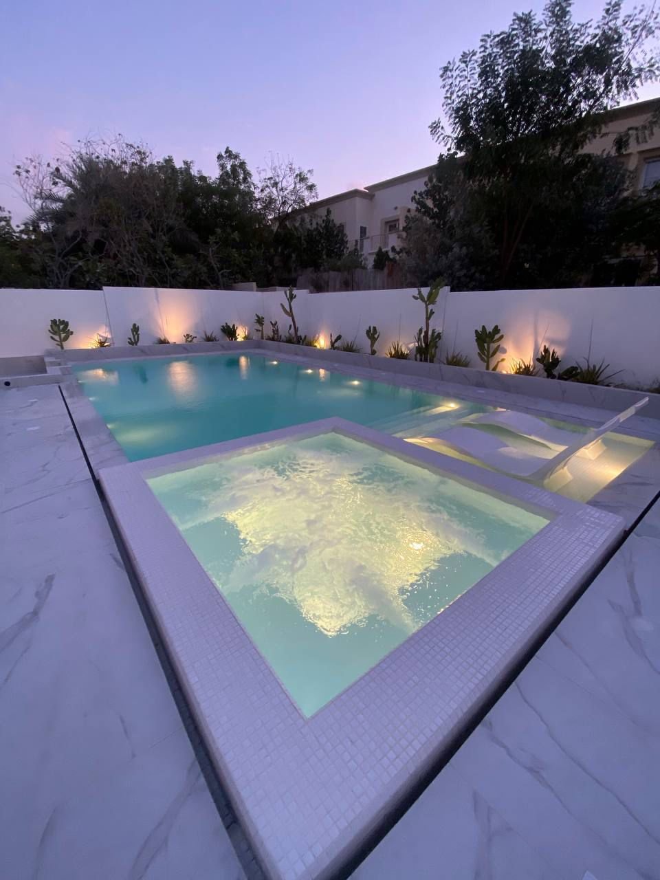 Landscaped garden with illuminated steps at night