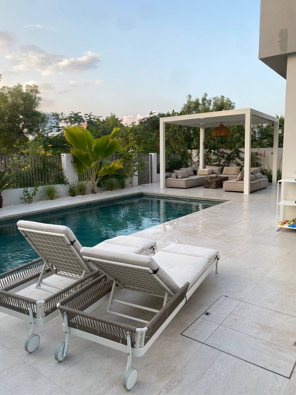 Large luxury pool with palms and villa