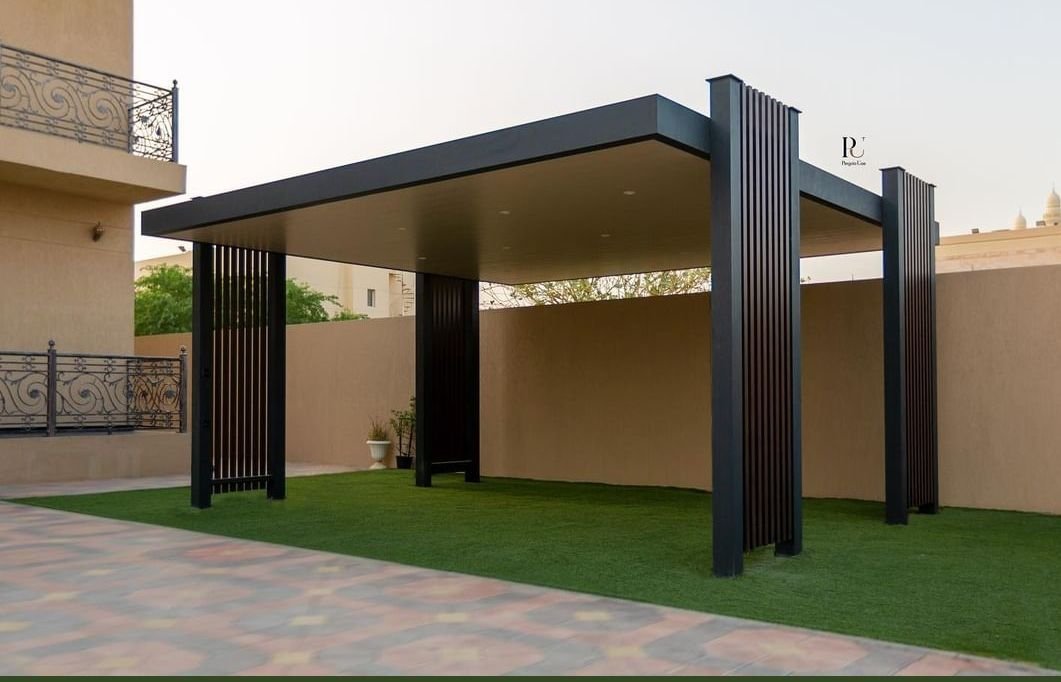 Pool with mosaic-tiled in-water sunbeds, white stone border