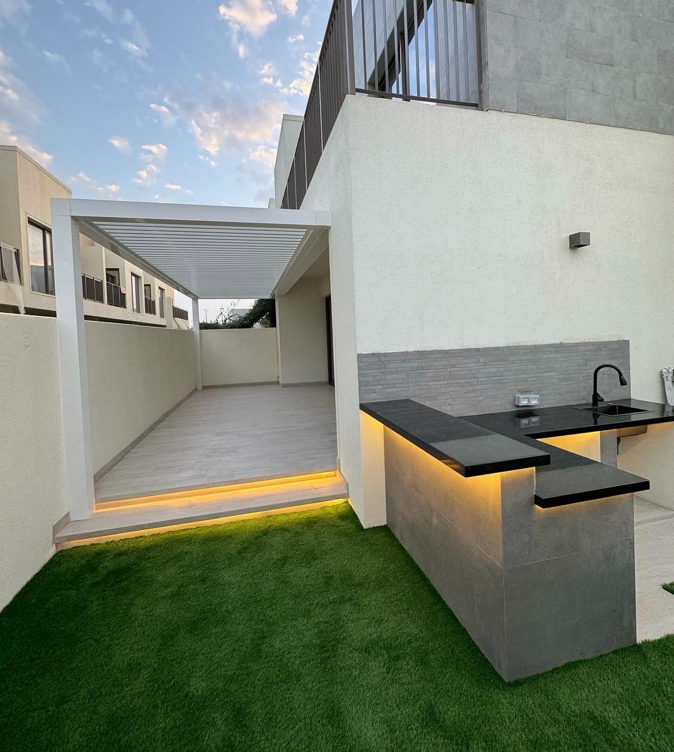 Marble waterfall cascading into pool